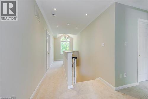 Hallway featuring an upstairs landing, light colored carpet, and recessed lighting - 3037 Abernathy Way, Oakville, ON - Indoor Photo Showing Other Room
