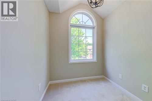 Computer Nook featuring light carpet, lofted ceiling, and suspended lighting - 3037 Abernathy Way, Oakville, ON - Indoor Photo Showing Other Room