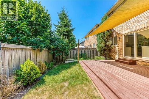 Fenced backyard featuring a deck - 3037 Abernathy Way, Oakville, ON - Outdoor