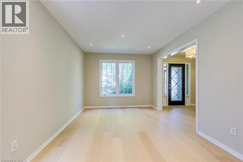 Living room/Dining room combinationwith light wood-style floors and recessed lighting - 3037 Abernathy Way, Oakville, ON - Indoor Photo Showing Other Room