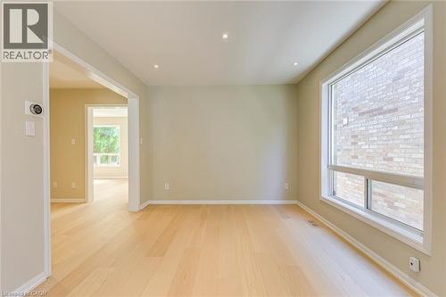 Dining room featuring light wood-style floors and recessed lighting - 3037 Abernathy Way, Oakville, ON - Indoor Photo Showing Other Room