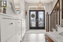 Entrance foyer featuring french doors and hanging lights - 105 Larry Crescent, Caledonia, ON  - Indoor Photo Showing Other Room 
