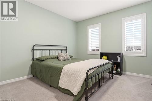 Bedroom featuring light colored carpet and baseboards - 105 Larry Crescent, Caledonia, ON - Indoor Photo Showing Bedroom