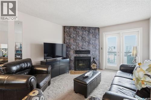 118 Cedar Meadow Drive, Regina, SK - Indoor Photo Showing Living Room With Fireplace