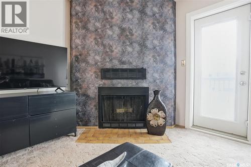118 Cedar Meadow Drive, Regina, SK - Indoor Photo Showing Living Room With Fireplace