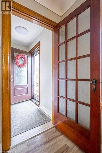 Entrance foyer featuring light wood-style floors and baseboards - 143 Huxley Avenue S, Hamilton, ON - Indoor Photo Showing Other Room
