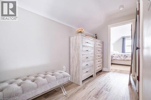 Bedroom featuring lofted ceiling and light wood-style floors - 143 Huxley Avenue S, Hamilton, ON - Indoor Photo Showing Bedroom