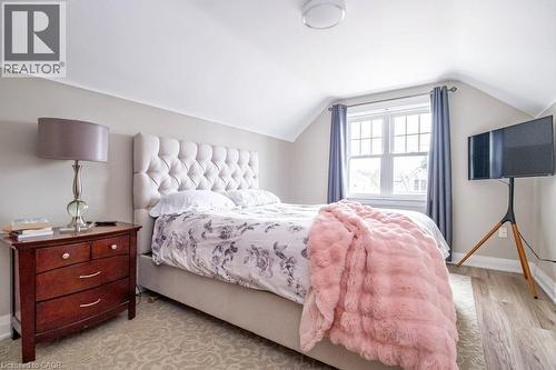 Bedroom with baseboards and light wood-style floors - 143 Huxley Avenue S, Hamilton, ON - Indoor Photo Showing Bedroom
