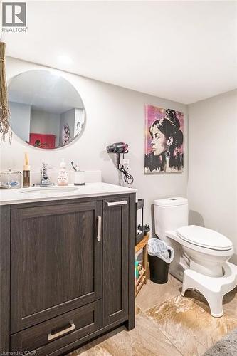 Half bathroom with vanity and toilet - 143 Huxley Avenue S, Hamilton, ON - Indoor Photo Showing Bathroom