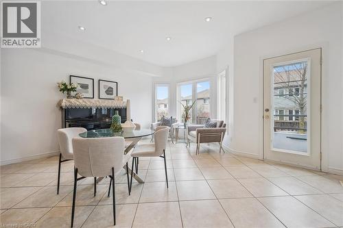 Dining room featuring recessed lighting and light tile patterned floors - 512 Wood Nettle Way, Waterloo, ON - Indoor Photo Showing Other Room