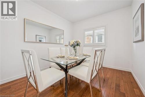 Dining space featuring hardwood / wood-style floors - 512 Wood Nettle Way, Waterloo, ON - Indoor Photo Showing Dining Room