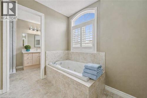 Bathroom with vanity and a whirlpool tub - 512 Wood Nettle Way, Waterloo, ON - Indoor Photo Showing Bathroom