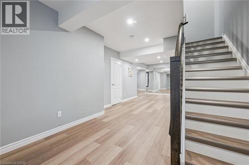 Stairs with wood finished floors and recessed lighting - 512 Wood Nettle Way, Waterloo, ON - Indoor Photo Showing Other Room