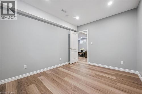 Unfurnished room featuring light wood finished floors and recessed lighting - 512 Wood Nettle Way, Waterloo, ON - Indoor Photo Showing Other Room