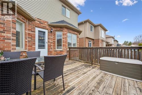 Wooden deck featuring outdoor dining space - 512 Wood Nettle Way, Waterloo, ON - Outdoor With Deck Patio Veranda