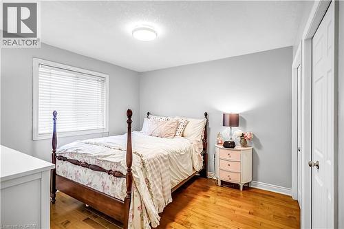 Bedroom featuring baseboards and light wood-type flooring - 65 Thistlemoor Drive, Caledonia, ON - Indoor Photo Showing Bedroom