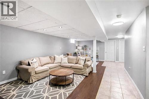 Living area with baseboards and light wood finished floors - 65 Thistlemoor Drive, Caledonia, ON - Indoor Photo Showing Living Room