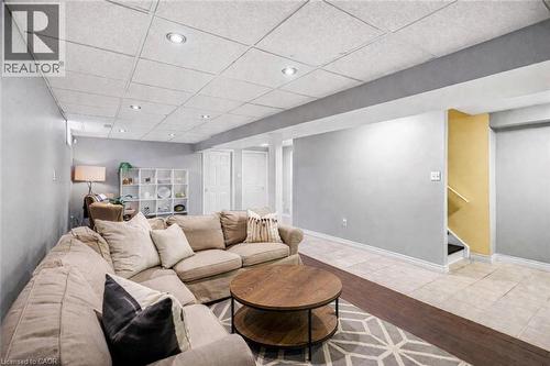 Living room featuring a paneled ceiling, light wood-style flooring, and recessed lighting - 65 Thistlemoor Drive, Caledonia, ON - Indoor Photo Showing Living Room