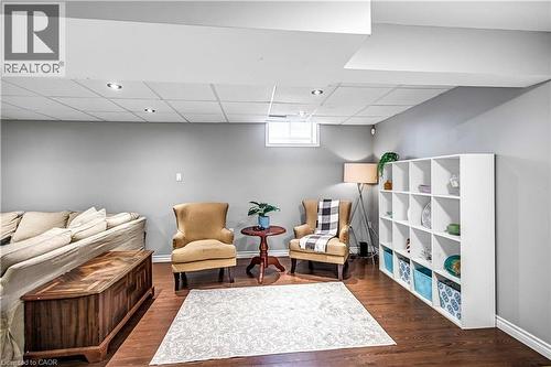 Sitting room with a drop ceiling and dark wood finished floors - 65 Thistlemoor Drive, Caledonia, ON - Indoor