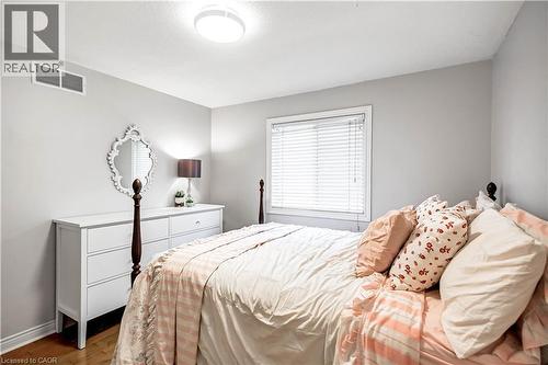 Bedroom with wood finished floors and baseboards - 65 Thistlemoor Drive, Caledonia, ON - Indoor Photo Showing Bedroom