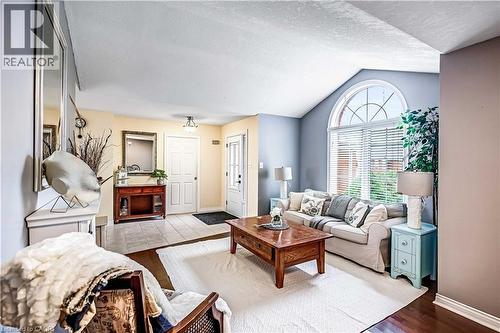 Living room featuring wood finished floors and baseboards - 65 Thistlemoor Drive, Caledonia, ON - Indoor Photo Showing Living Room