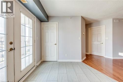 Unfurnished bedroom featuring baseboards and a textured ceiling - 1411 Walker'S Line Unit# 302, Burlington, ON - Indoor Photo Showing Other Room
