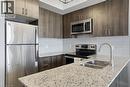 560 North Service Road Unit# 708, Grimsby, ON  - Indoor Photo Showing Kitchen With Double Sink With Upgraded Kitchen 