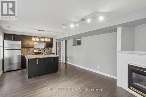 360 Culpepper Place, Waterloo, ON - Indoor Photo Showing Kitchen With Fireplace