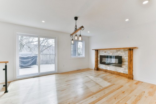 Salle à manger - 345 Rue Louis-Hébert, Mascouche, QC - Indoor Photo Showing Living Room With Fireplace