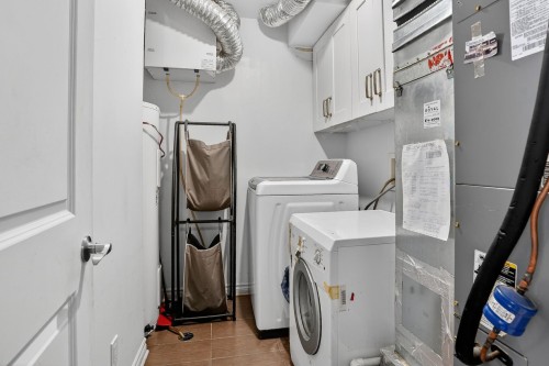 Salle de lavage - 34D Boul. Des Sources, Pointe-Claire, QC - Indoor Photo Showing Laundry Room