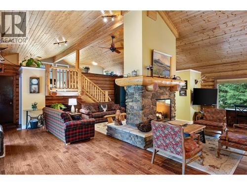 7799 Golf Course Road, Anglemont, BC - Indoor Photo Showing Living Room With Fireplace