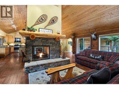 7799 Golf Course Road, Anglemont, BC - Indoor Photo Showing Living Room With Fireplace