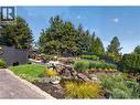 Featuring very impressive landscaping with a water feature **Image digitally enhanced to showcase the property's seasonal potential** - 336 Quilchena Drive, Kelowna, BC  - Outdoor 