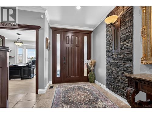 Hallway to the third bedroom & full bathroom on the upper level - 336 Quilchena Drive, Kelowna, BC - Indoor