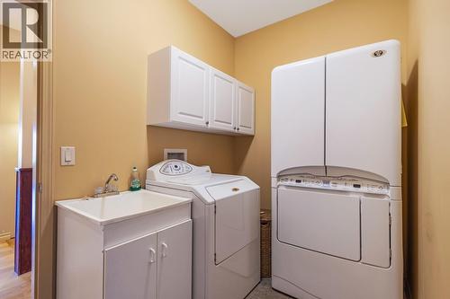 Laundry by garage access - 610 Arrowleaf Lane, Kelowna, BC - Indoor Photo Showing Laundry Room