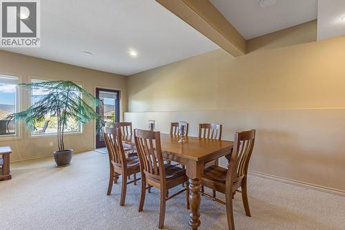 Separate basement entrance with access from driveway - 610 Arrowleaf Lane, Kelowna, BC - Indoor Photo Showing Dining Room