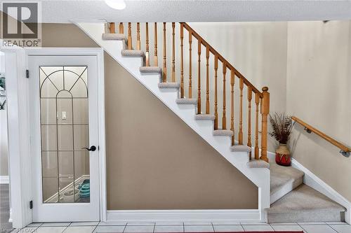 Staircase with a textured ceiling and tile patterned flooring - 3753 Densbury Drive, Mississauga, ON - Indoor Photo Showing Other Room