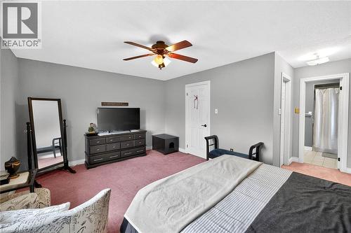 Bedroom featuring ceiling fan, light colored carpet, and ensuite bath - 3753 Densbury Drive, Mississauga, ON - Indoor Photo Showing Bedroom
