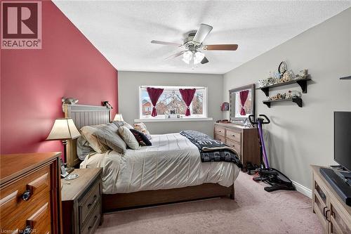 Bedroom featuring light carpet, a ceiling fan, and a textured ceiling - 3753 Densbury Drive, Mississauga, ON - Indoor Photo Showing Bedroom