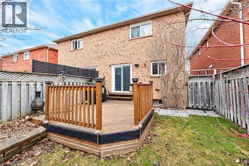Back of house featuring a fenced backyard, a deck, and brick siding - 3753 Densbury Drive, Mississauga, ON - Outdoor With Exterior