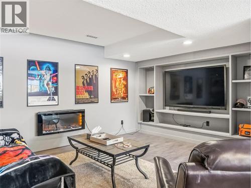 13323 Torvan Subdivision, Dawson Creek, BC - Indoor Photo Showing Living Room With Fireplace