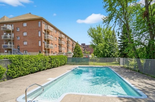 Pool - 114-450 Rue St-Georges, Saint-Lambert, QC - Outdoor With In Ground Pool