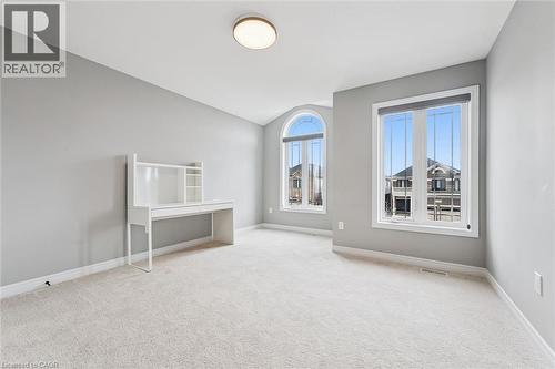 Unfurnished room featuring light carpet and vaulted ceiling - 628 Florencedale Crescent, Kitchener, ON - Indoor Photo Showing Other Room