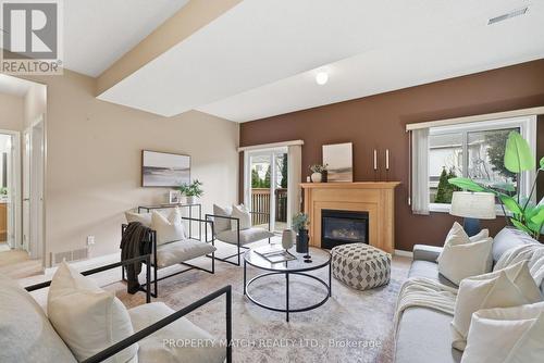 Family Room with walkout to backyard - 680 Ormond Drive, Oshawa, ON - Indoor Photo Showing Living Room With Fireplace