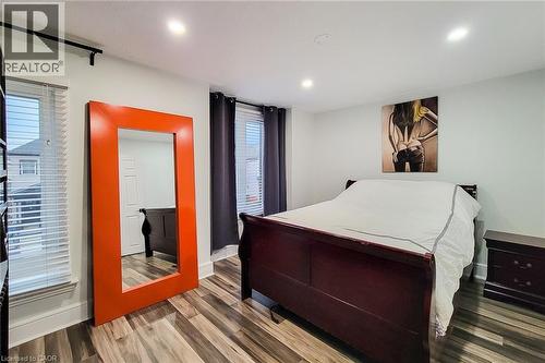 Bedroom featuring wood finished floors and recessed lighting - 97 Keith Street, Hamilton, ON - Indoor Photo Showing Bedroom