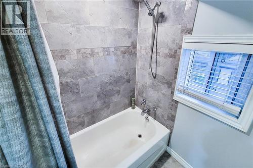 Bathroom with shower / bath combo with shower curtain - 97 Keith Street, Hamilton, ON - Indoor Photo Showing Bathroom