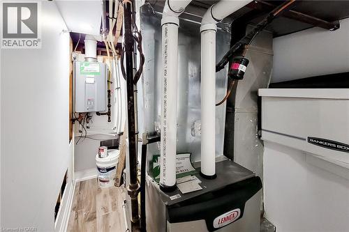 Utilities with heating unit and water heater - 97 Keith Street, Hamilton, ON - Indoor Photo Showing Basement