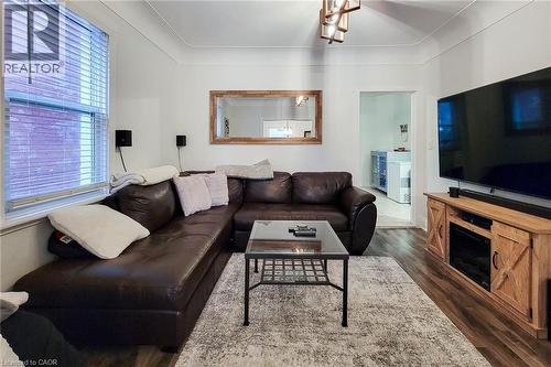 Living room featuring dark wood finished floors - 97 Keith Street, Hamilton, ON - Indoor Photo Showing Living Room
