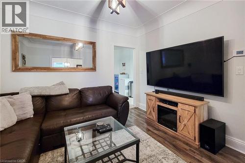 Living room with ceiling fan and dark wood-type flooring - 97 Keith Street, Hamilton, ON - Indoor Photo Showing Living Room
