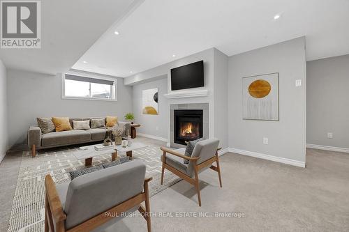 Virtually Staged-Basement Rec Room - 4958 Abbott Street E, Ottawa, ON - Indoor Photo Showing Living Room With Fireplace